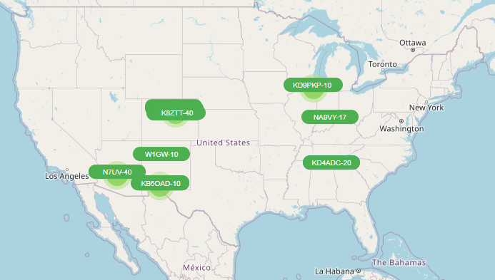 Map of the USA showing hotspots of LoRa APRS activity feeding lora-aprs.live in Chicago, Denver, Phoenix, and Las Cruces with a few other scattered stations.